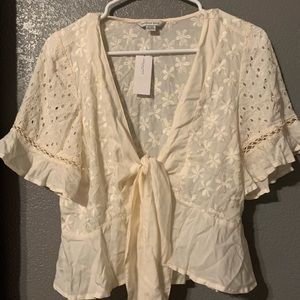 American eagle lace and peep hole tie top